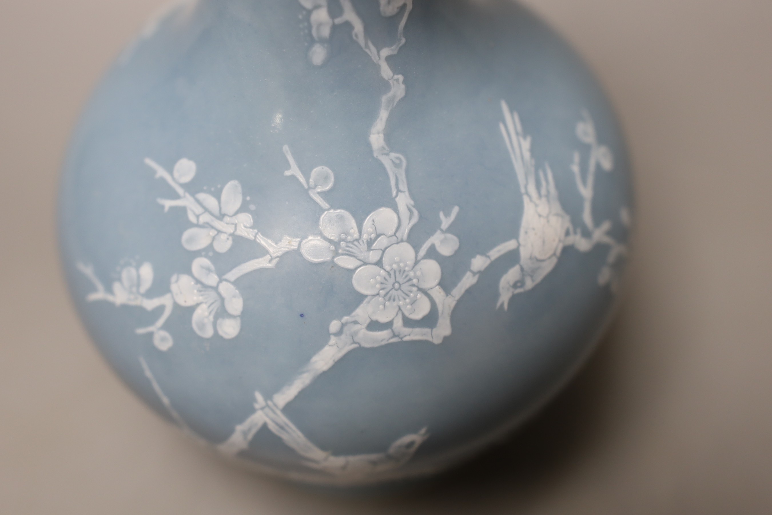 A Chinese claire de lune glazed white slip decorated vase - 25cm high